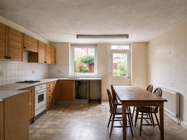 Closed-off dated kitchen concept before an open-plan extension
