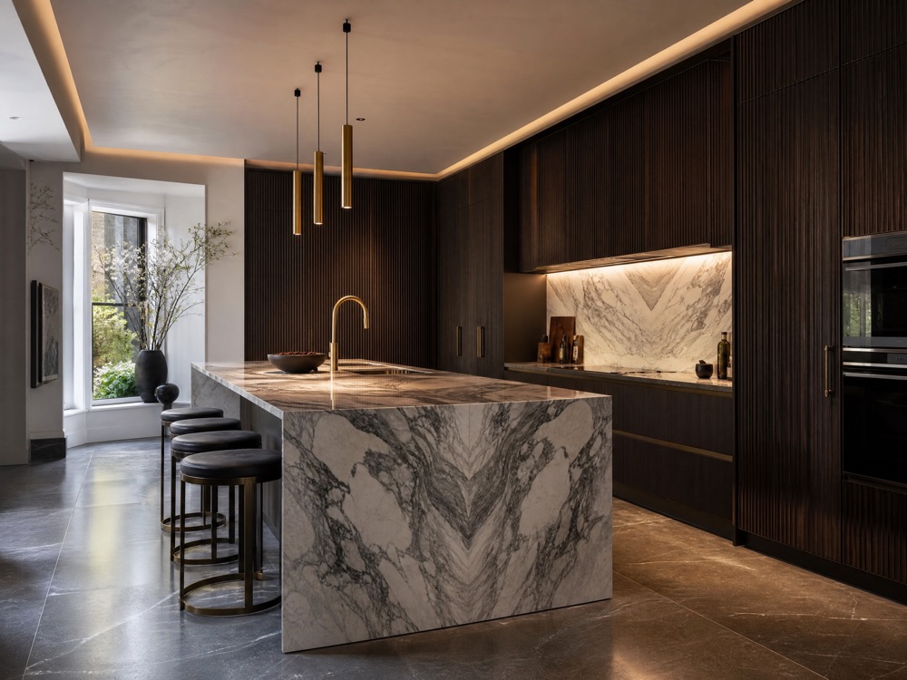 Concept image of a contemporary kitchen with dark fluted timber and a marble island